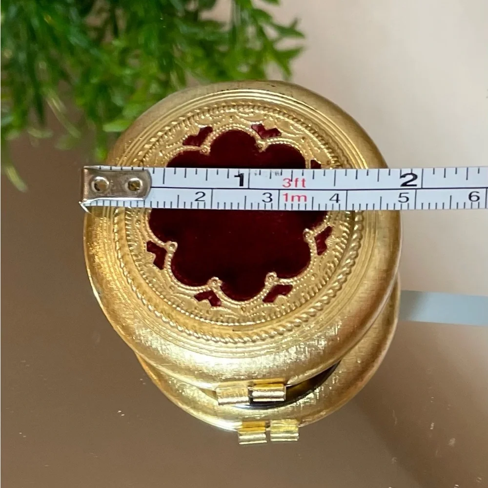 Vintage Revlon “Love Pat” Gold-tone Powder Compact with Burgundy Velvet Accent.